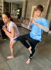 Children doing yoga promotes happiness and minfulness and fun