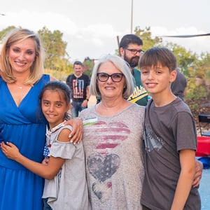 When visiting home and connecting in person is no longer an option, it is important to remind your parents that they have to be safe for us all. This is a photo of my mom, my two kids and me. When she is here, everything feels manageable.