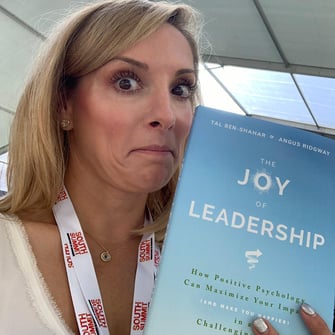 English for Fun Founder Jill Stribling, Educational Influencer Life for Fun, testing out the book The Joy of Leadership by Tal Ben-Shahar